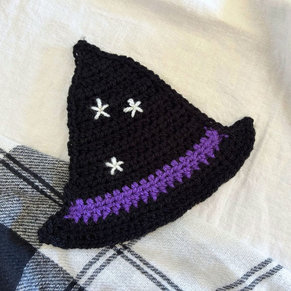 The Bewitched Hat Coaster free crochet pattern will add magic to your Halloween home decor.